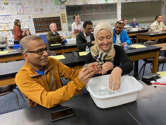 Parents participating in science experiment